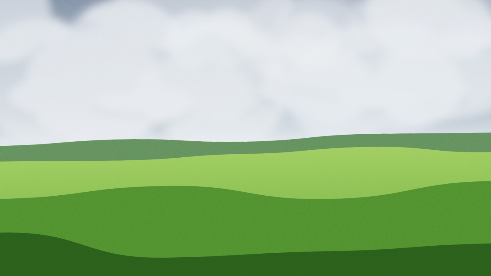 A low grey overcast sky over a green field that rolls away beneath it.